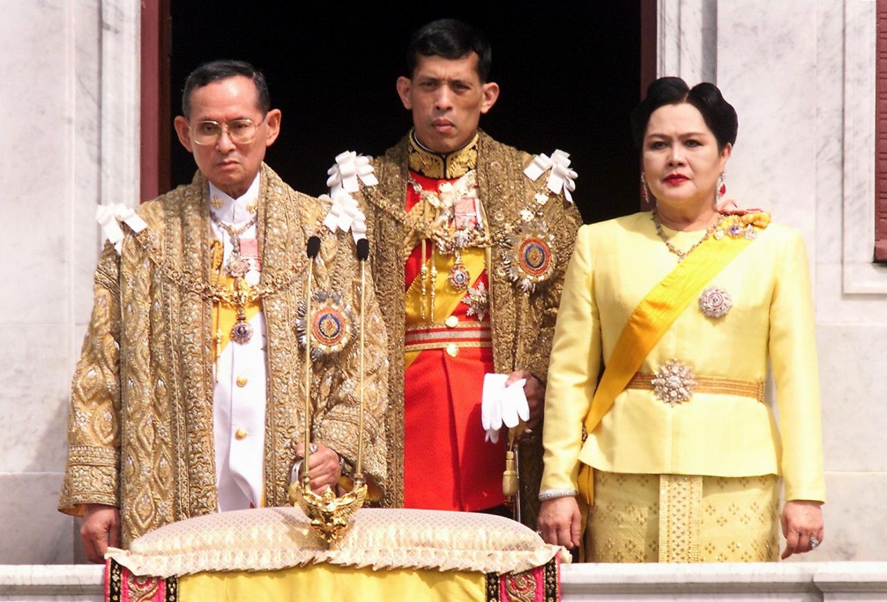 Vajiralongkorn and his parents stand on the balcony of Anantasamakom Throne Hall in 1999.
