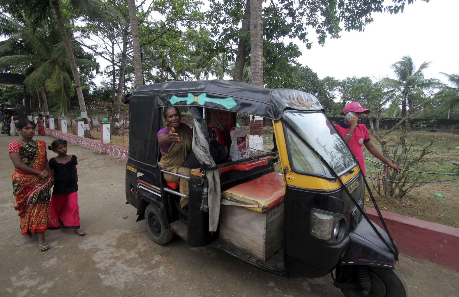 Villagers from Chandrabhaga arrive at a government-run school building after evacuating their homes on May 2.