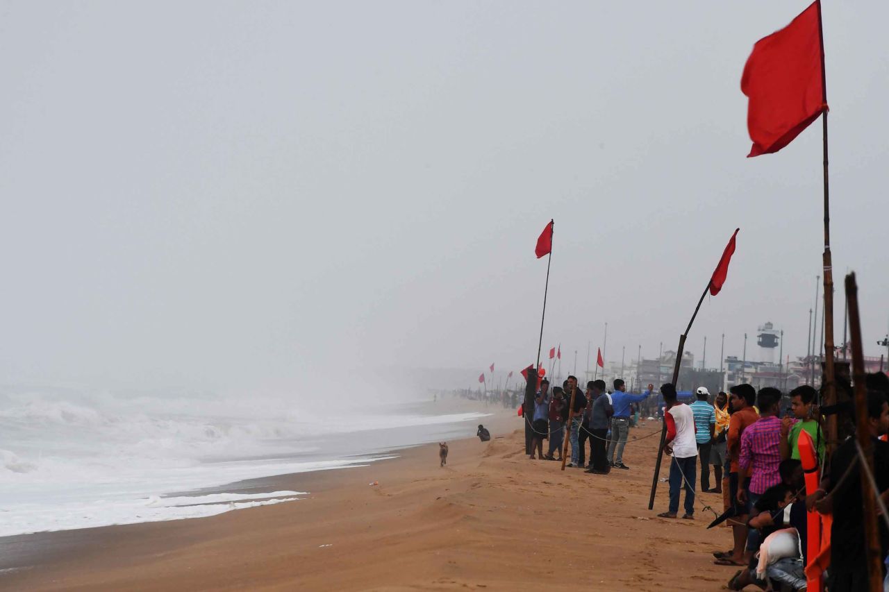 People view the turbulent sea from a closed beach in Puri on Thursday, May 2.