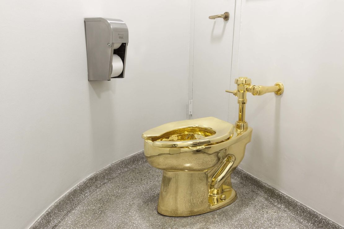 Maurizio Cattelan's gold toilet, "America" (2016), seen at its former location at New York's Guggenheim Museum.