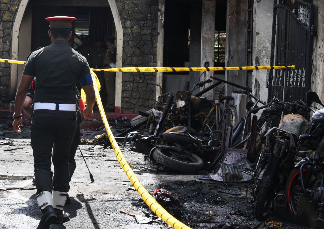 Sri Lankan security personnel walk past debris outside Zion Church following an explosion in Batticaloa in eastern Sri Lanka on April 21, 2019. 