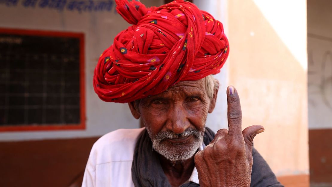 A man shows his ink-marked finger after casting his vote in the outskirts of Ajmer, in the Indian state of Rajasthan, on April 29. 