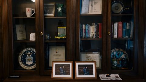 Photos of Miller with Sen. Mitch McConnell sit on the bookshelf in her office.