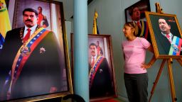 CODEPINK activist Medea Benjamin speaks to reporters, surrounded by pictures of former President of Venezuela Hugo Chavez and current president Nicolas Maduro, near the entrance of the Venezuelan embassy in Washington, DC on April 19, 2019. - Activists opposed to supporters of Venezuelan opposition leader Juan Guaido and their takeover of diplomatic buildings belonging to the Venezuelan government of Nicolas Maduro have been staging a 24/7 vigil to protect the Venezuelan Embassy in Washington DC. (Photo by Andrew CABALLERO-REYNOLDS / AFP)        (Photo credit should read ANDREW CABALLERO-REYNOLDS/AFP/Getty Images)