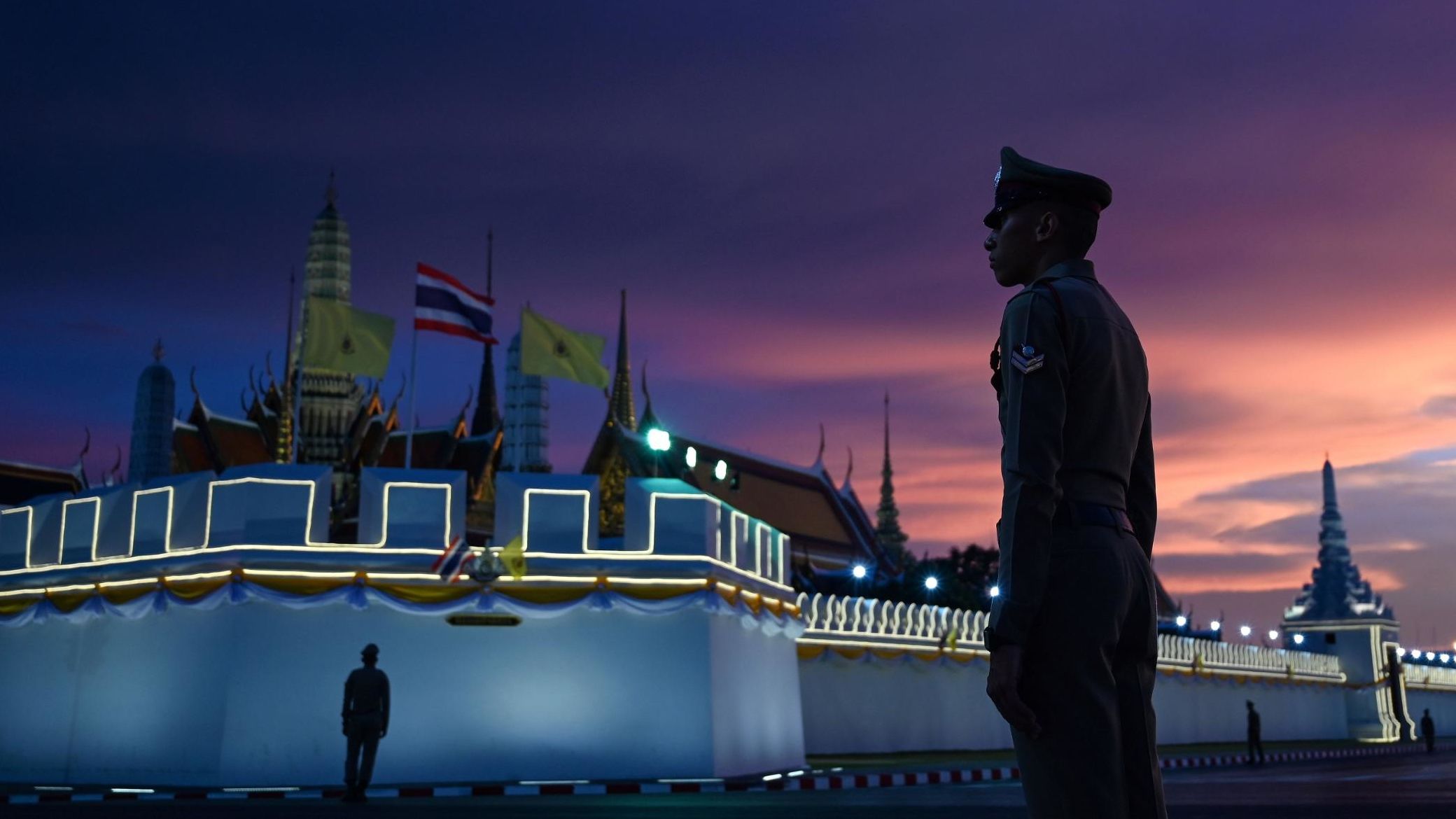 Royal Thai police stand guard near the Grand Palace in Bangkok on Friday, May 3, ahead of King Maha Vajiralongkorn's coronation.