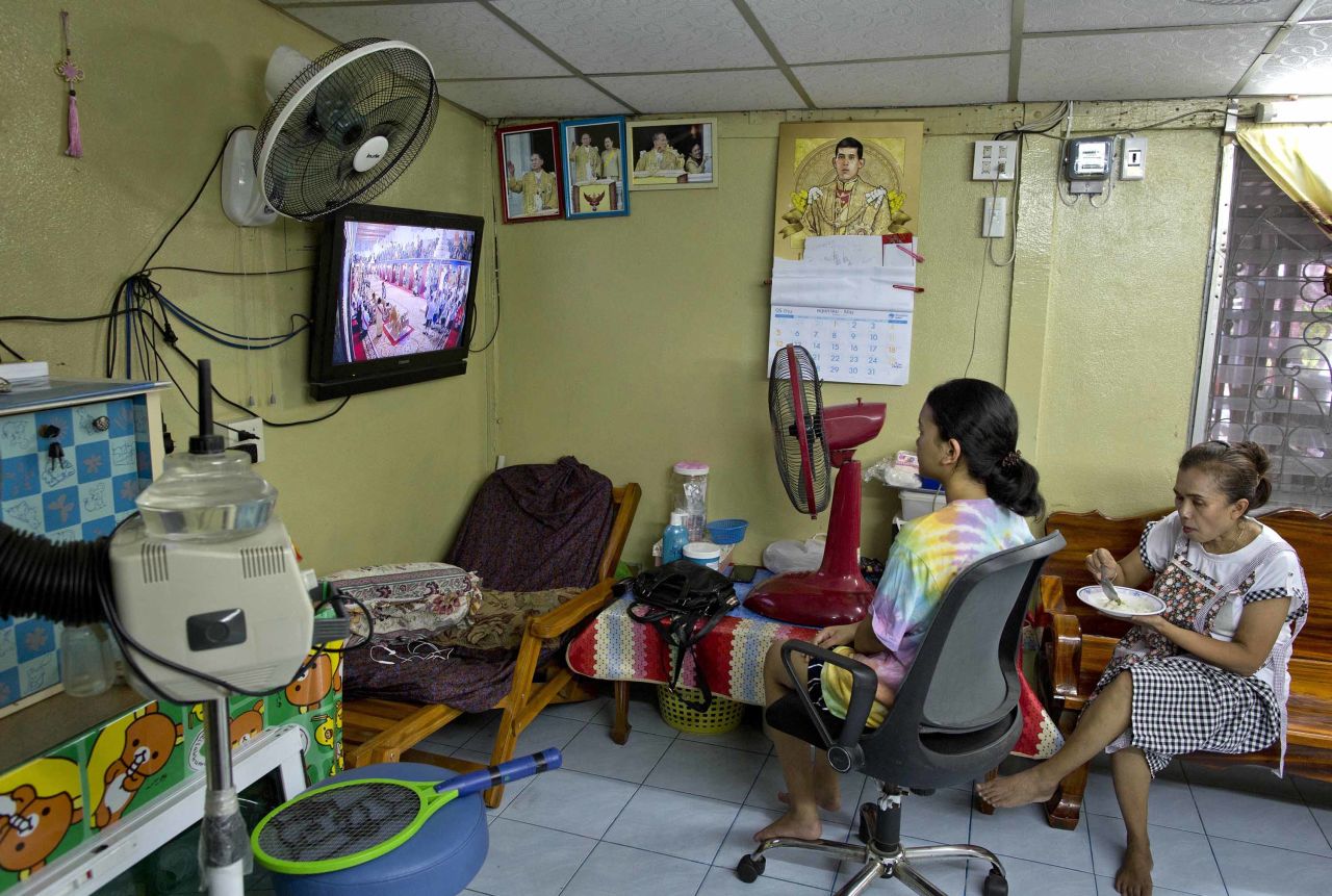 People in a beauty salon watch a live broadcast of the coronation ceremony.