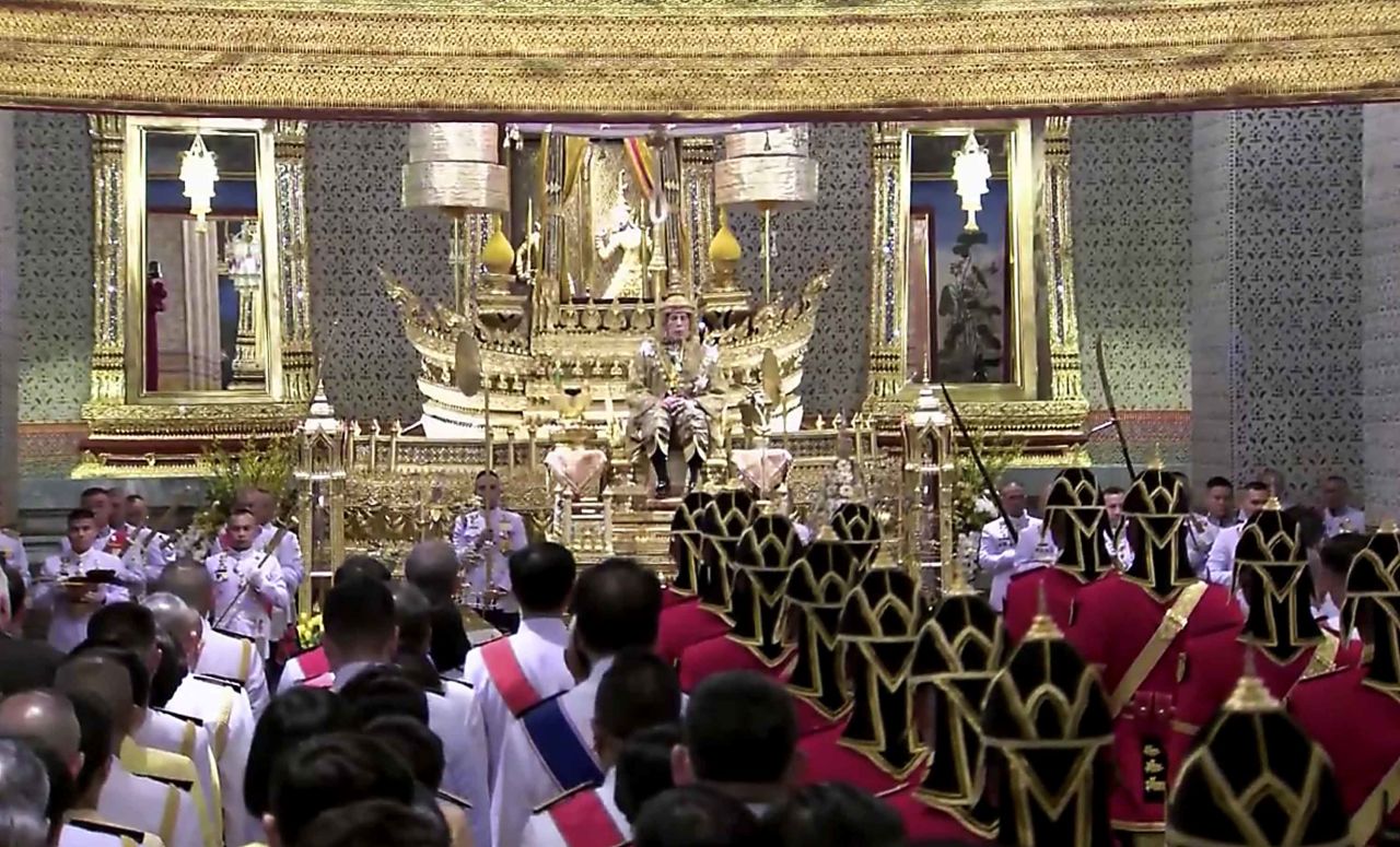 King Vajiralongkorn sits on the throne before an audience of diplomats and dignitaries at the Grand Palace on May 4.