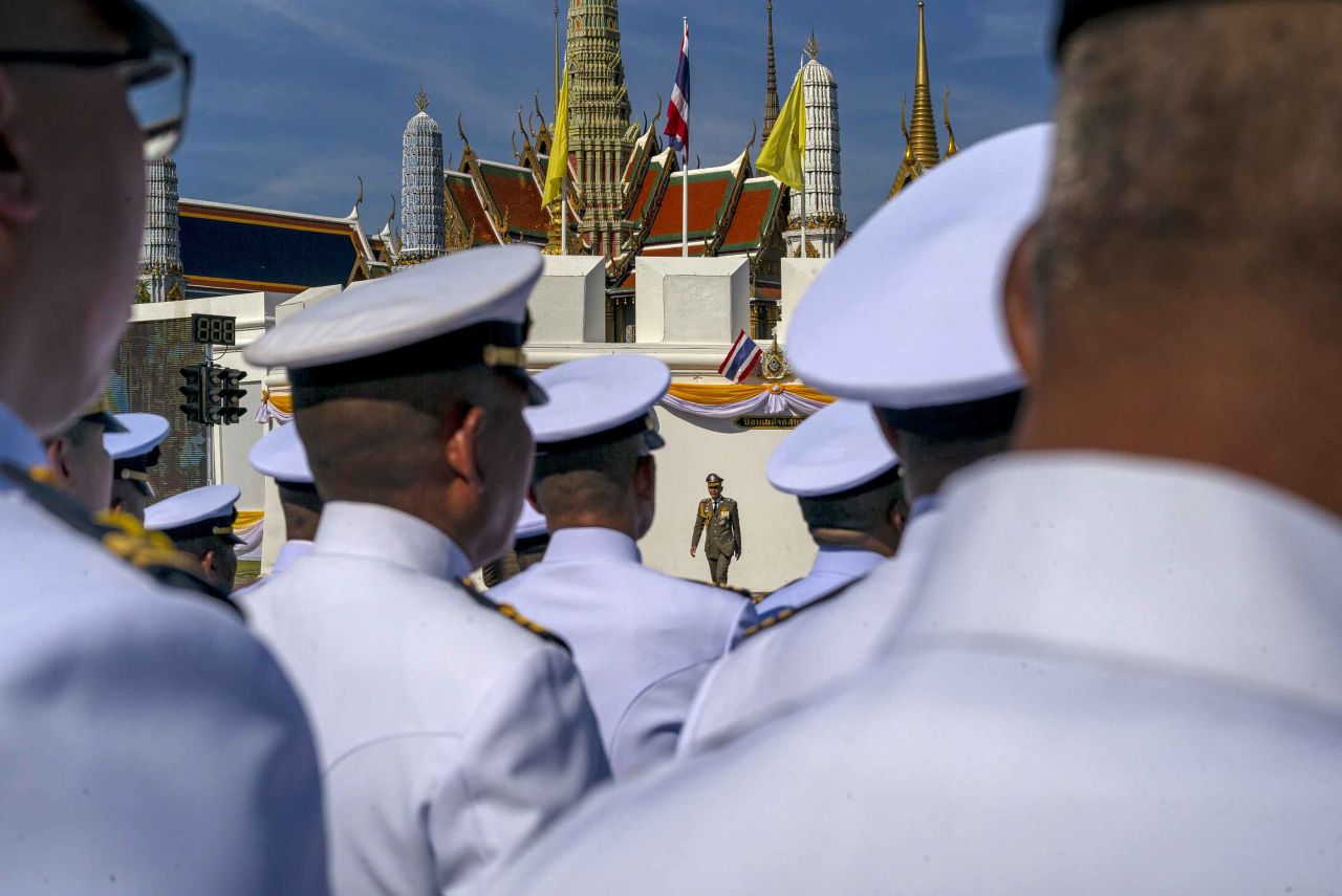 Government officials stand outside the Royal Palace to await the arrival of King Maha Vajiralongkorn on May 4.