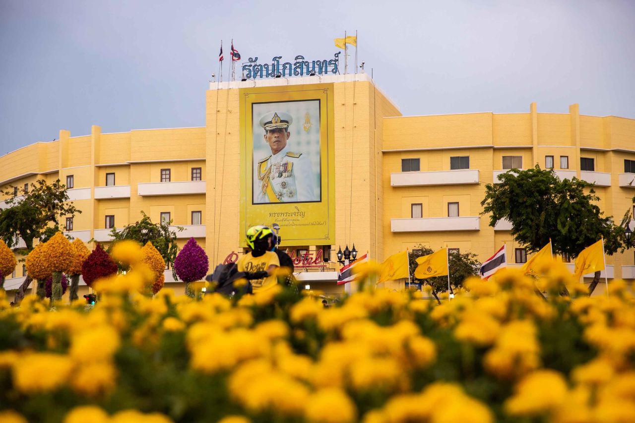 A portrait of King Maha Vajiralongkorn hangs near Thailand's Royal Palace ahead of the coronation on May 3. The color yellow is associated with the day of the King's birth -- Monday. In Thailand, every day of the week corresponds to a color.