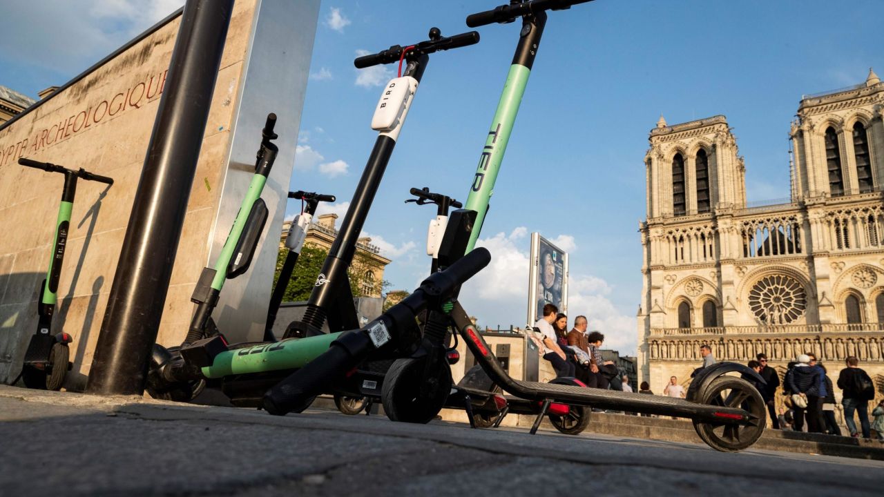 Electric scooters of providers Tier and Bird are pictured on April 1, 2019 in front of Notre-Dame de Paris Cathedral in Paris. - The market for personal mobility devices (EDP for 'engins de deplacement personnel' in French), like electric scooters, electric unicycles and hoverboards, rose by 32 per cent in value in 2018, and was driven by a strong growth of 76 per cent of the electric scooter market, according to a study published April 1, 2019. (Photo by KENZO TRIBOUILLARD / AFP)        (Photo credit should read KENZO TRIBOUILLARD/AFP/Getty Images)