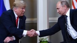 Russian President Vladimir Putin (R) and US President Donald Trump shake hands before a meeting in Helsinki, on July 16, 2018. (Photo by Brendan Smialowski / AFP)        (Photo credit should read BRENDAN SMIALOWSKI/AFP/Getty Images)