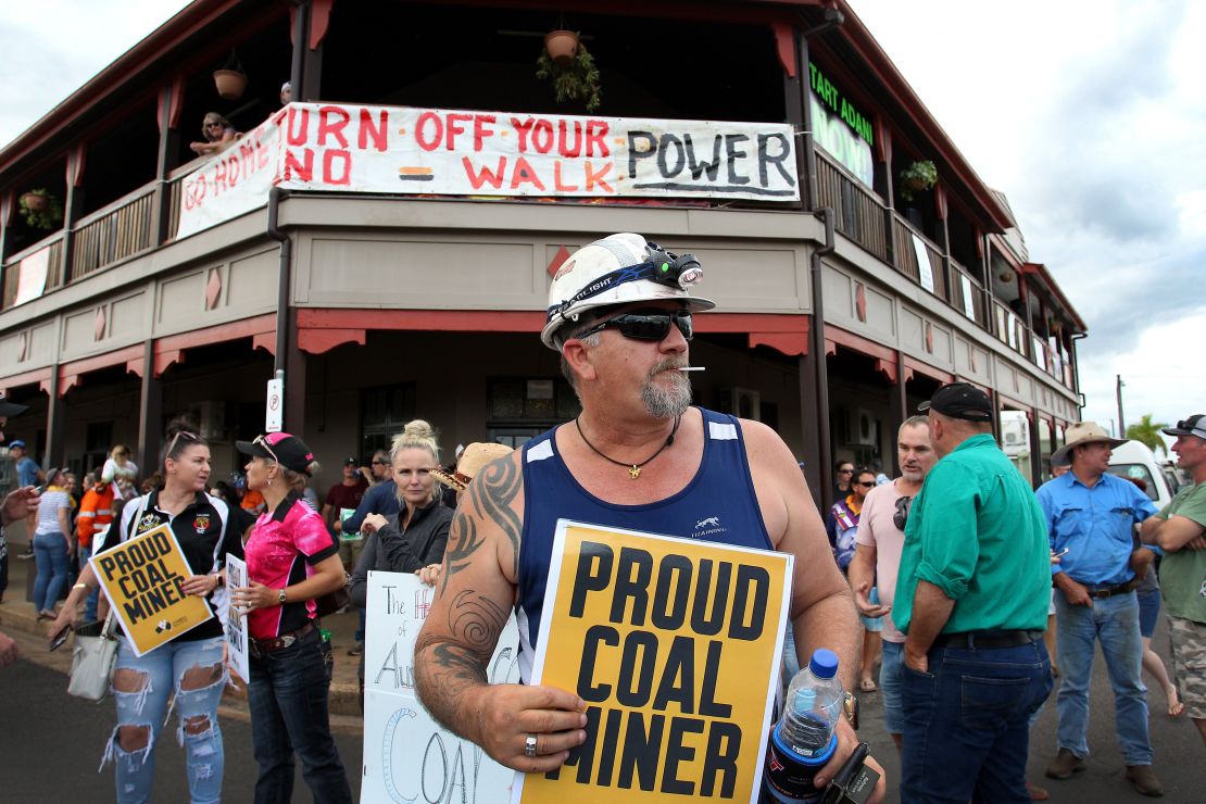 Locals and pro-Adani supporters gather outside the Commercial Hotel to protest against anti-Adani activists as they arrive in Clermont by convoy on April 27.