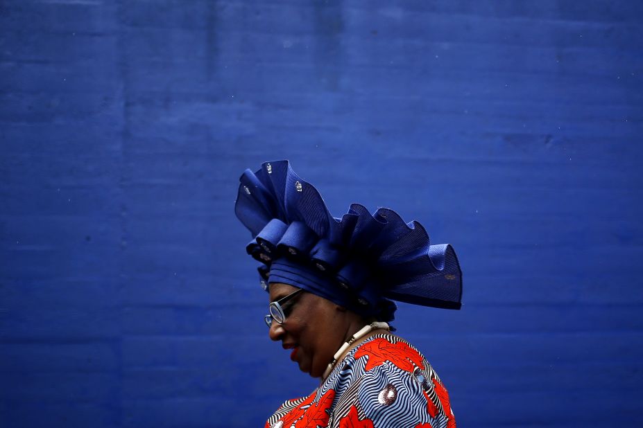 A woman wearing a festive hat attends the 145th running of the Kentucky Derby at Churchill Downs.