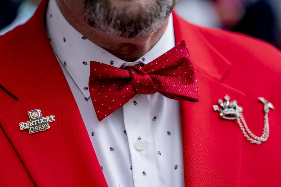 A man wears a rose themed shirt and jacket combo prior to the Kentucky Derby.