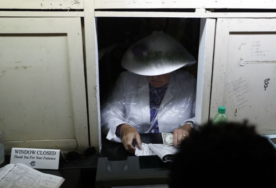 A woman places a bet before the 145th running of the Kentucky Derby Churchill Downs.