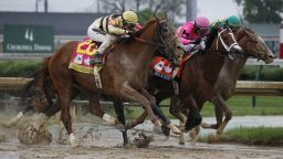 Luis Saez rides Maximum Security, center, to victory during the 145th running of the Kentucky Derby horse race at Churchill Downs Saturday, May 4, 2019, in Louisville, Ky. (AP Photo/John Minchillo)