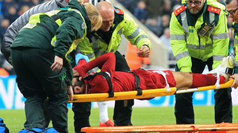 Salah is placed on a stretcher after suffering a head injury against Newcastle.