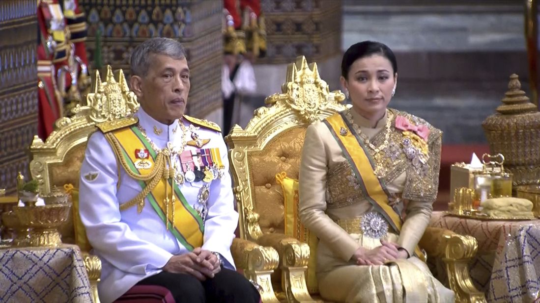 In this image, taken from video, King Maha Vajiralongkorn and Queen Suthida attend attend a ceremony that includes bestowing royal titles and granting ranks at the Grand Palace in Bangkok on May 5.