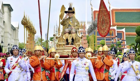 Royal bearers transport Thailand's King Maha Vajiralongkorn on the royal palanquin during his visit to the Temple of the Emerald Buddha in Bangkok on Saturday, May 4.