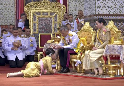 In this image taken from Thai TV, King Maha Vajiralongkorn and Queen Suthida attend a coronation ceremony that includes bestowing of the royal title and ranks to royals at the Grand Palace in Bangkok on Sunday.