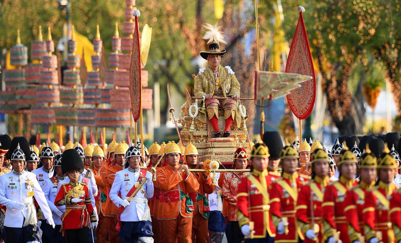 Thailand's King Maha Vajiralongkorn is carried in a golden palanquin during a coronation procession in Bangkok on Sunday, May 5.