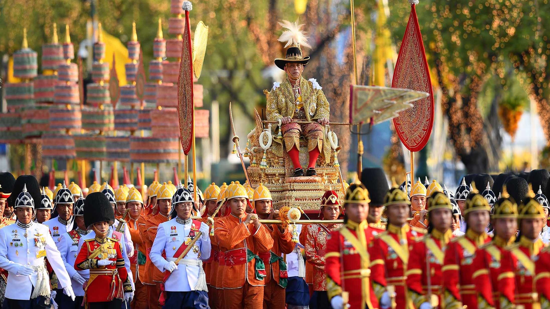 Thailand's King Maha Vajiralongkorn is carried in a golden palanquin during a coronation procession in Bangkok on Sunday, May 5.
