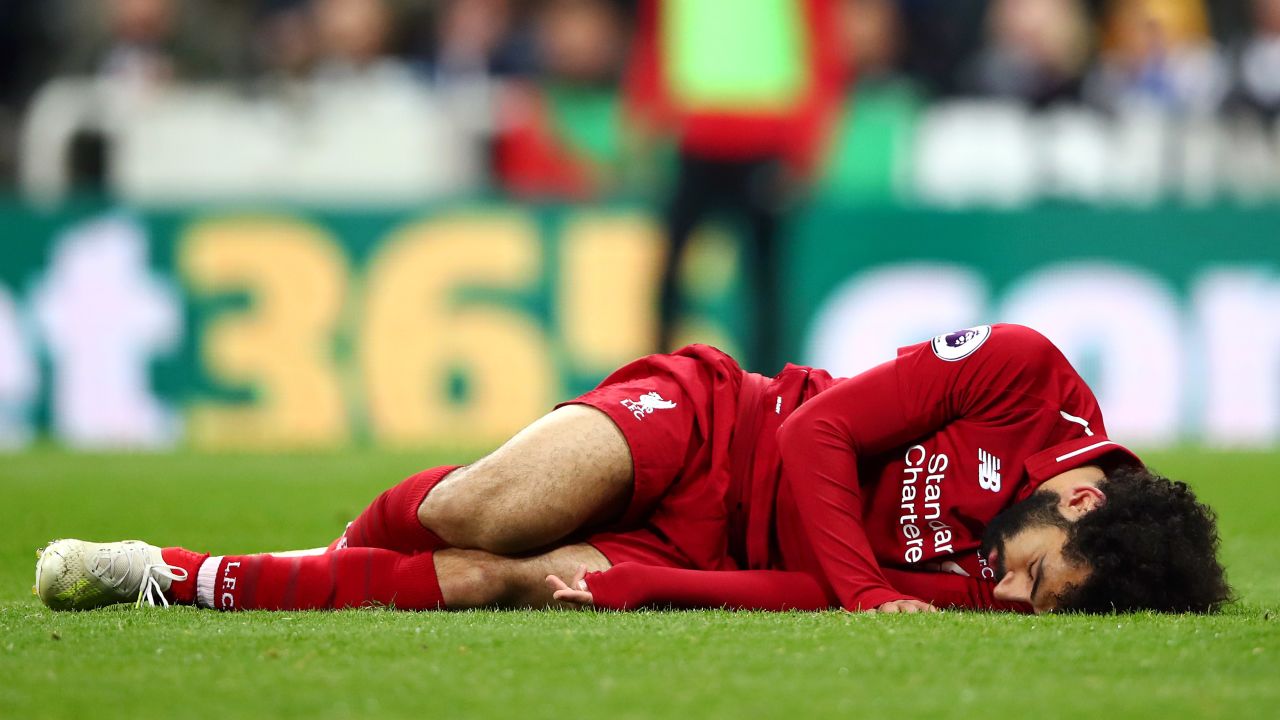 Mohamed Salah of Liverpool goes down injured during win at Newcastle.