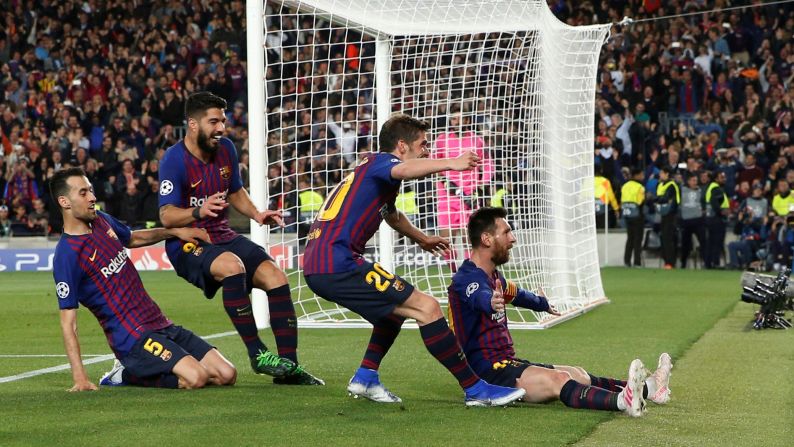 Lionel Messi celebrates with teammates Sergi Roberto, Luis Suarez and Sergio Busquets after scoring a goal off a <a href="index.php?page=&url=https%3A%2F%2Fbleacherreport.com%2Farticles%2F2834036-lionel-messi-scores-600th-barcelona-goal-with-stunning-free-kick-vs-liverpool" target="_blank" target="_blank">free-kick</a> during a Champions League Semi Final match against Liverpool on May 1 in Barcelona, Spain. The goal marked Messi's 600th career goal as a member of FC Barcelona.
