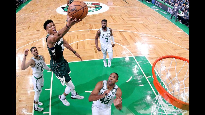 Giannis Antetokounmpo of the Milwaukee Bucks takes a shot over Al Horford (42) of the Boston Celtics during Game 3 of the NBA Eastern Conference Semifinals at TD Garden on May 3 in Boston, Massachusetts. The Bucks defeated the Celtics 123 - 116.