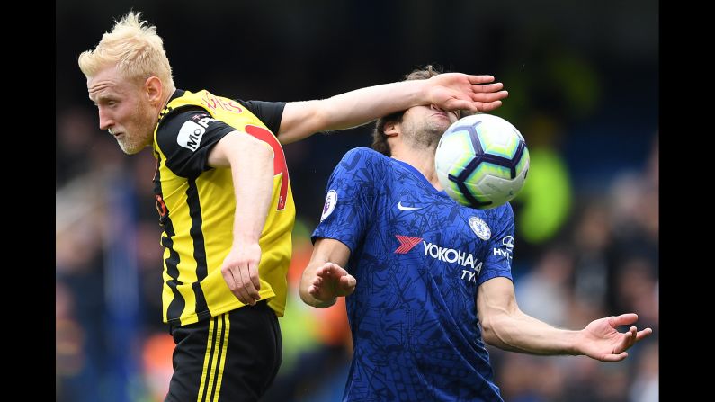 Watford's midfielder Will Hughes, left, smacks Chelsea's Marcos Alonso in the face while making a play on the ball during a Premier League match in London, England on Sunday, May 5.