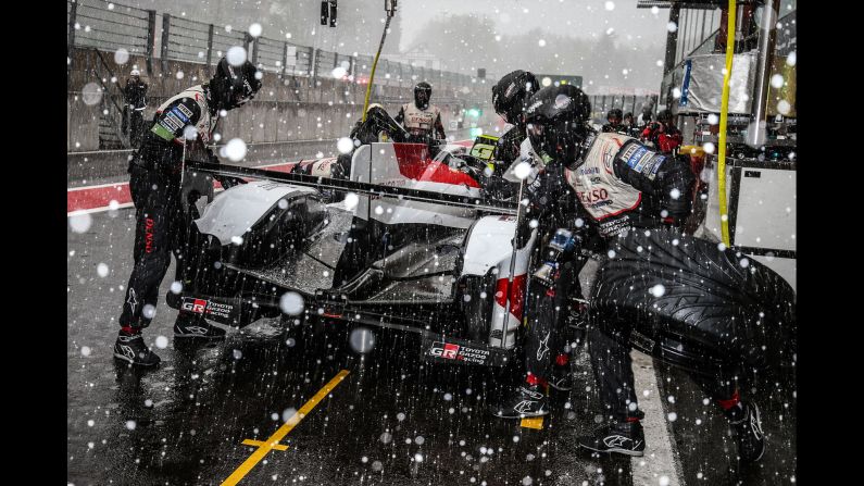 The #08 Toyota, driven by Sebastien Buemi, Kazuki Nakajima, and Fernando Alonso makes a pit stop as snow falls at the WEC Six Hours of Spa on May 4 in Stavelot, Belgium.