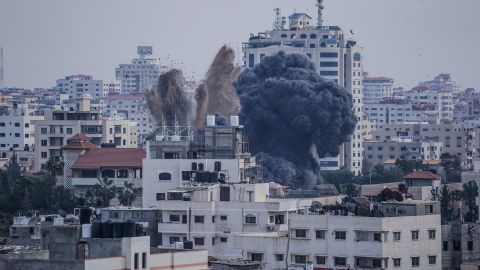 Smoke is sen rising after an Israeli air raid on homes in Gaza City.