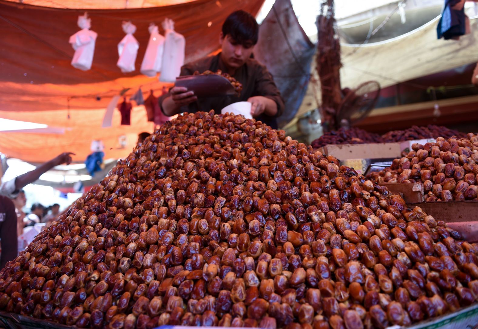 A Pakistani vendor sells dates at a market in Karachi on May 5, in preparation for the Muslim fasting month of Ramadan.