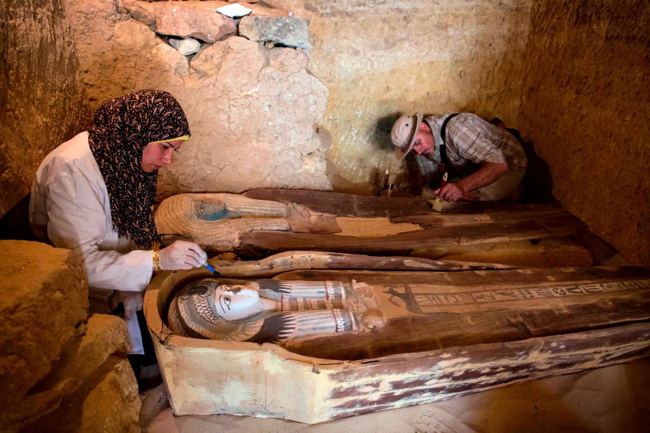Excavation workers inside the tomb