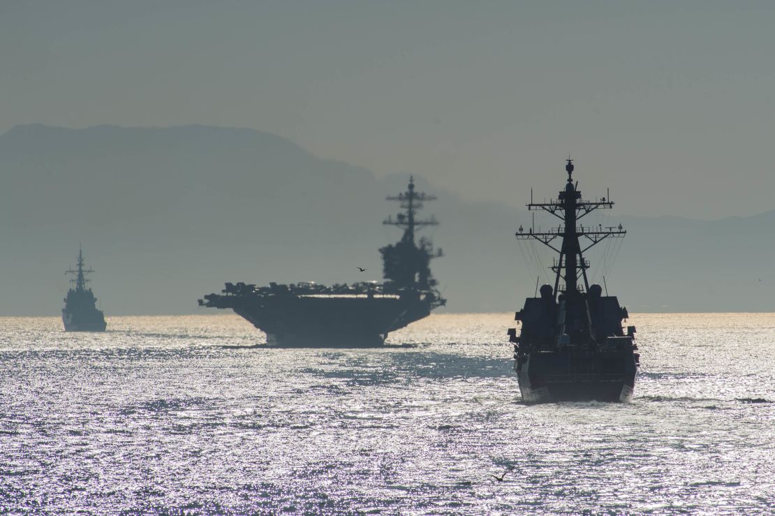 The Arleigh Burke-class guided-missile destroyer USS Bainbridge, right, the Nimitz-class aircraft carrier USS Abraham Lincoln, and the Spanish navy Alvaro de Bazan-class frigate ESPS Méndez Núñez transit the Strait of Gibraltar, entering the Mediterranean Sea.