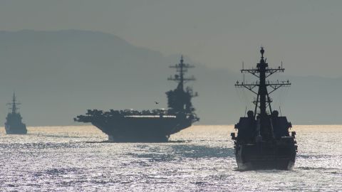 The guided-missile destroyer USS Bainbridge, right, and the  USS Abraham Lincoln transit the Strait of Gibraltar, entering the Mediterranean Sea, in April.