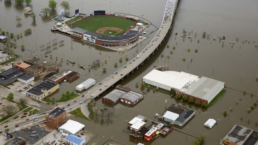 An aerial photo of Davenport, Iowa, shows Modern Woodmen Park, top, and the surrounding area covered by Mississippi River floodwaters, Friday, May 3, 2019. Iowa Gov. Kim Reynolds visited Davenport Friday. Several blocks of downtown Davenport were flooded this week when a flood barrier succumbed to the onslaught of water. (Kevin E. Schmidt/Quad City Times via AP)