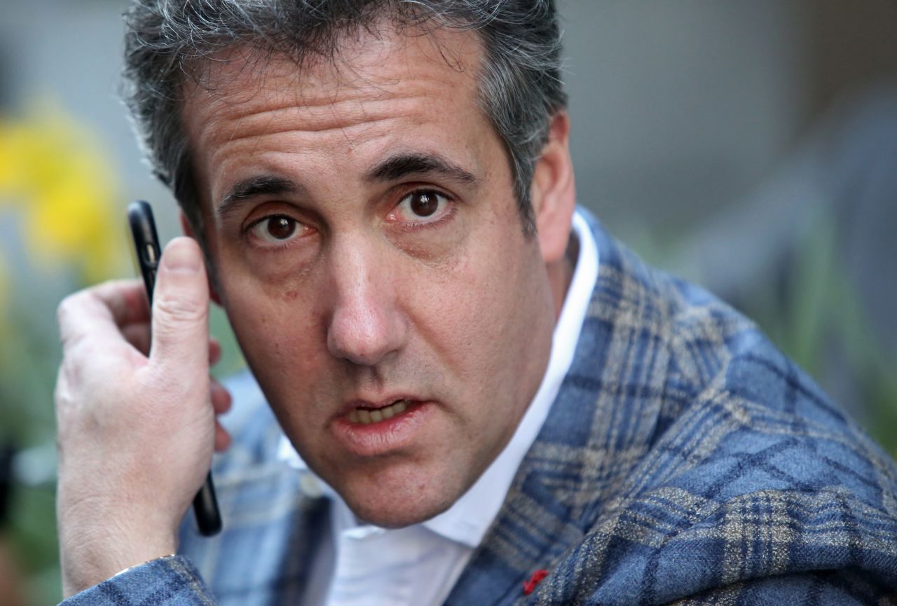 Cohen takes a call near the Loews Regency hotel in New York in April 2018. Following the FBI raids on his home, office and hotel room, the Department of Justice announced that they were placing him under criminal investigation.