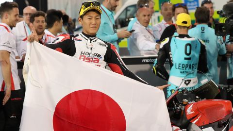 Kaito Toba, pictured holding a Japanese flag, has come through the ranks of Moto GP. 