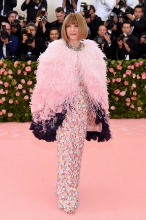 Gala organizer and Vogue's editor-in-chief Anna Wintour kicked off the event in a sequined pink gown and feathered cape by Chanel. 