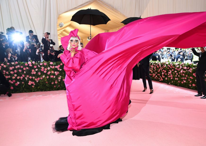 Scroll through the gallery to see other looks from the Met Gala in 2019: <br /><br />Few stars are better suited to the "camp" theme than Lady Gaga, one of the event's co-hosts, who has a long history of exaggerated and theatrical looks. Much was expected from Gaga -- and she stole the show in a billowing fuchsia gown by Brandon Maxwell, complete with huge train carried by a cohort of tuxedo-wearing, umbrella-wielding men. <br />
