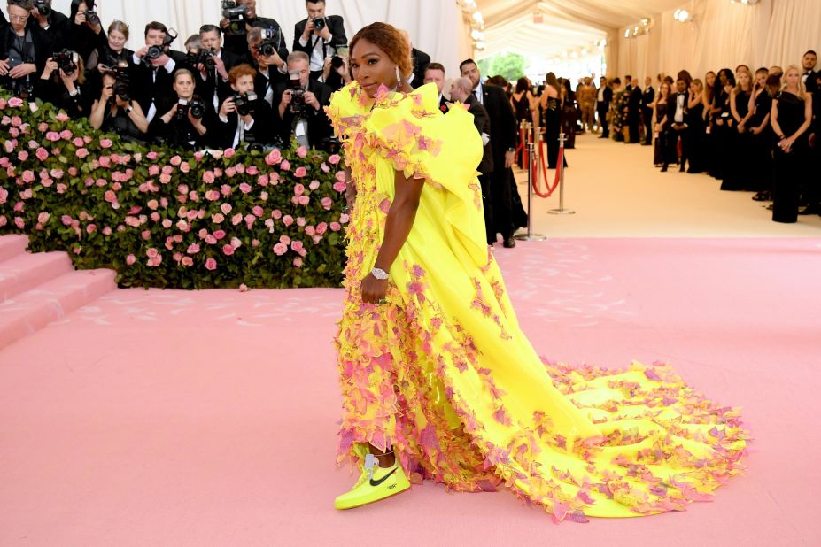 Co-host Serena Williams has previously wowed the Met Gala red carpet with gowns by the likes of Oscar de la Renta. This year, she opted for a stunning fluorescent Versace gown -- which she lifted to reveal a pair of similarly bright Nike sneakers, made in collaboration with Off-White.