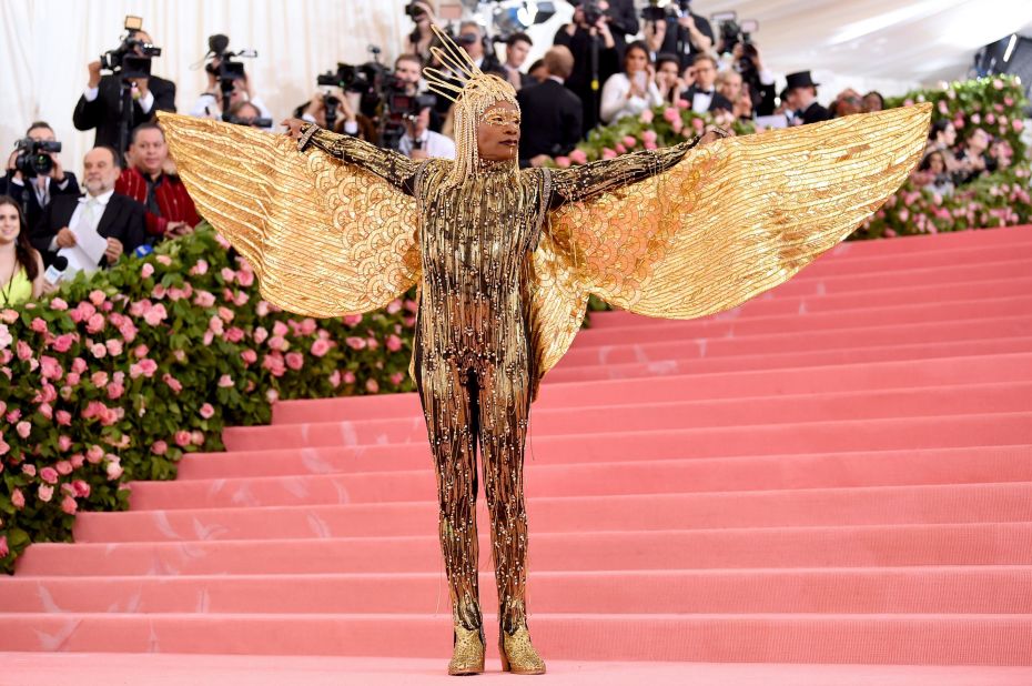 "Pose" star Billy Porter has been the darling of this year's red carpets, having lit up the Oscars and the Golden Globes with his bold fashion choices. He didn't disappoint at the Met Gala, arriving in a chaise carried by six shirtless men. His Ancient Egypt-inspired outfit included a gold jumpsuit with wings by The Blonds.  