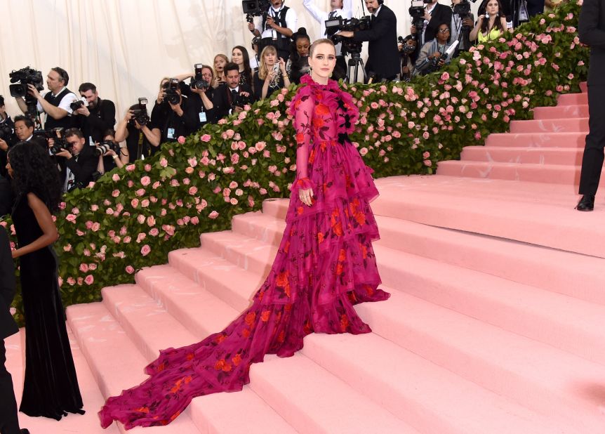 At her first Met Gala appearance, Rachel Brosnahan wowed in a long-sleeved pink gown by Erdem. 