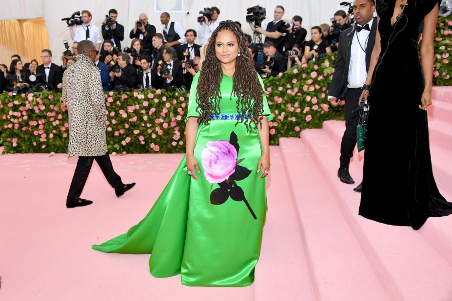 Ava DuVernay arrives in an eye-catching green gown by Prada.