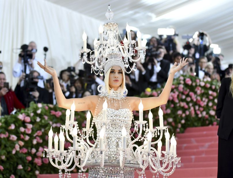 Whether it's enormous angel wings or a spray-painted dress, Katy Perry always takes the Met Gala theme seriously. And what better motif for her than "camp," a look the singer has embodied on red carpets for more than a decade? Unsurprisingly, Perry went all-out this year, as a life-sized chandelier with electric candles and dripping with crystals, designed by Moschino's Jeremy Scott.