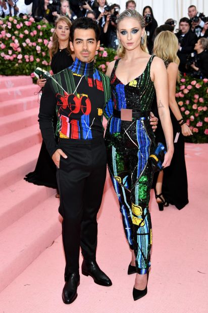 Joe Jonas and Sophie Turner in complementary Louis Vuitton outfits.
