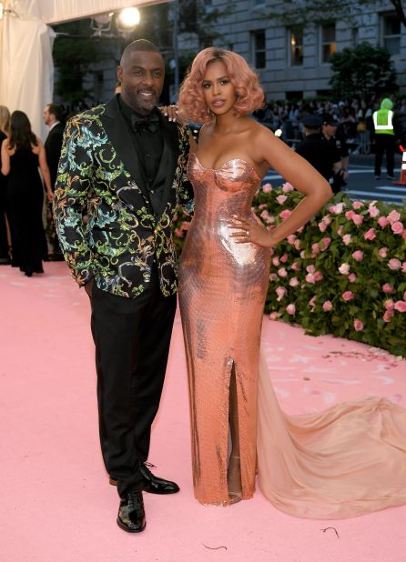 Newlyweds Idris Elba and Sabrina Dhowre on the red carpet just days after tying the knot. Elba wore a Versace glittery suit.