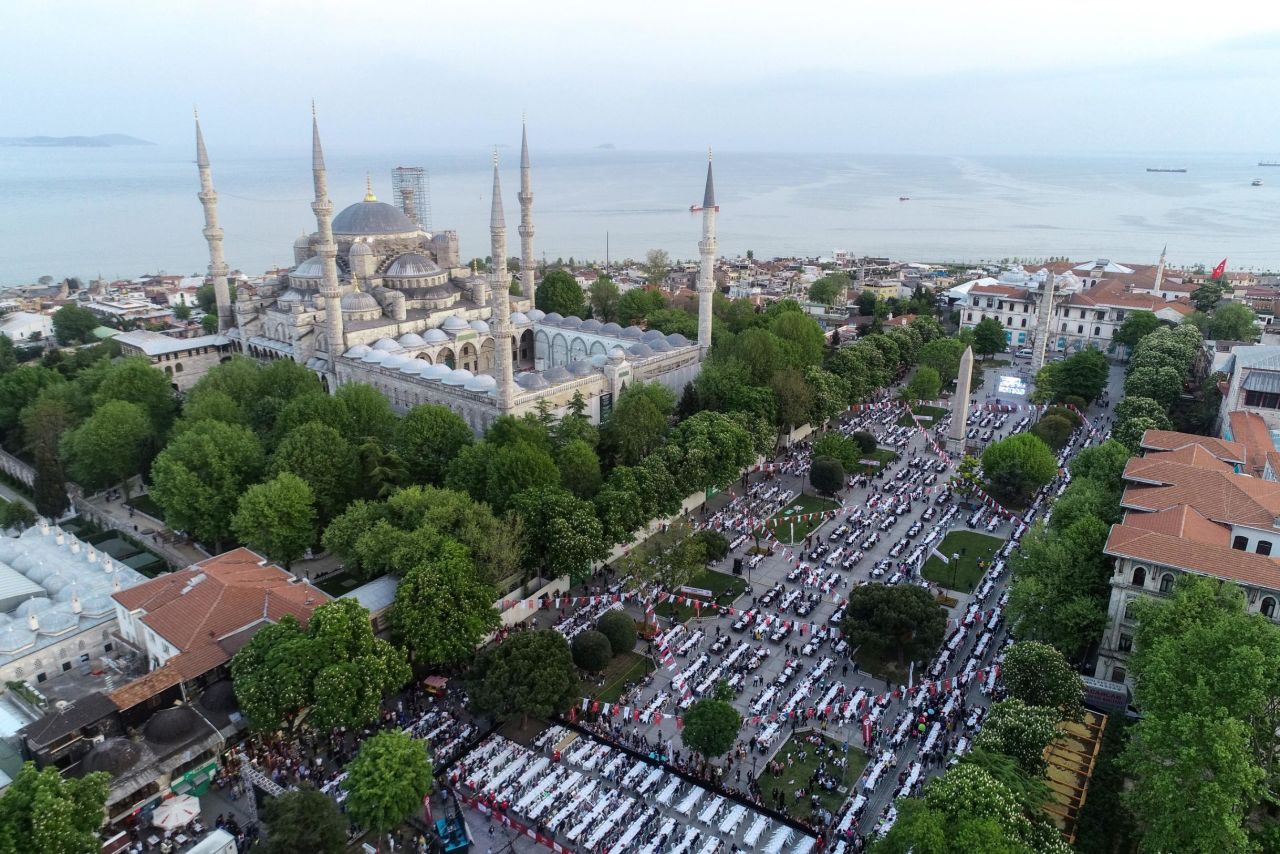 A drone photo shows thousands of people gather for iftar (fast-breaking) dinner during the Holy fasting month of Ramadan at Sultanahmet Square in Istanbul, Turkey on Monday, May 6.