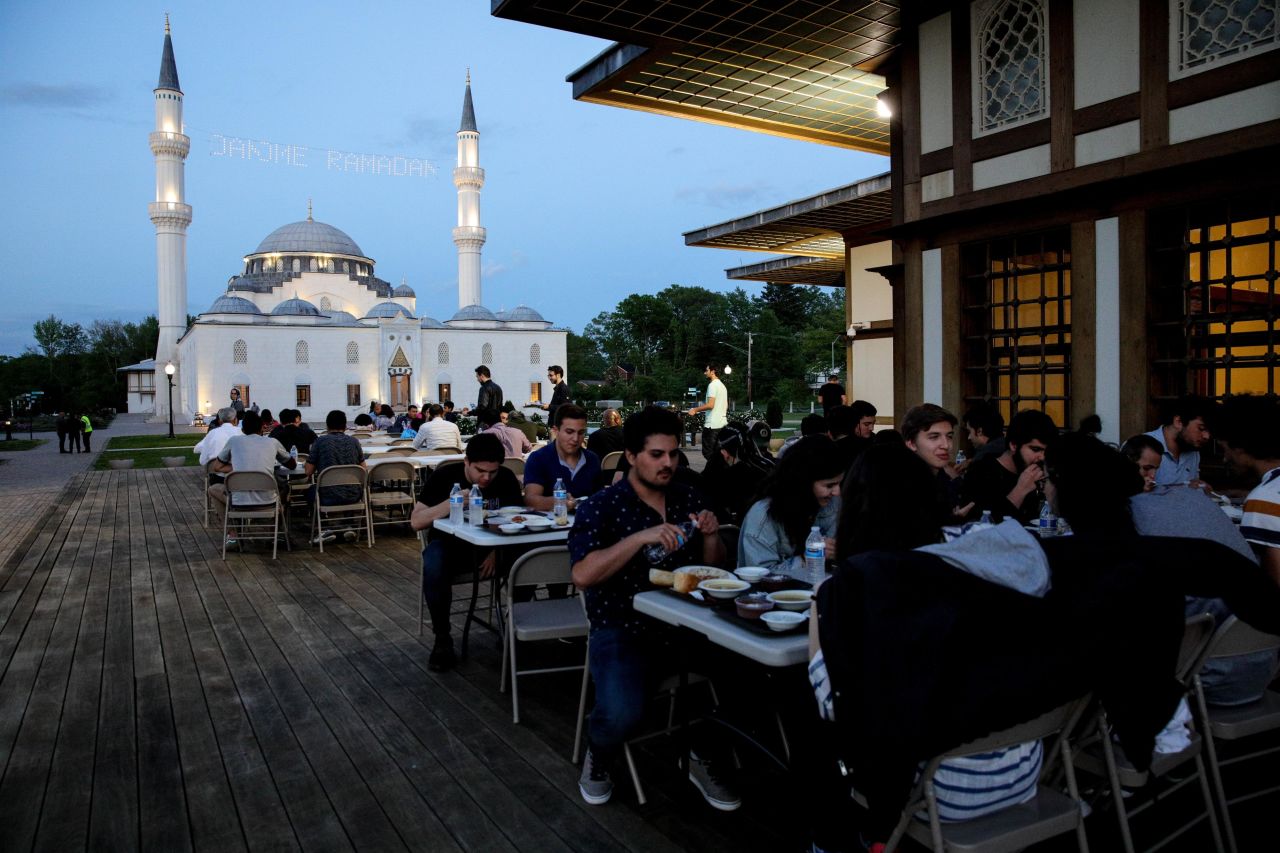 American Muslims attend an iftar (fast-breaking dinner) on the first day of the holy month of Ramadan at Diyanet Center of America (DCA) in Maryland, United States on Monday.